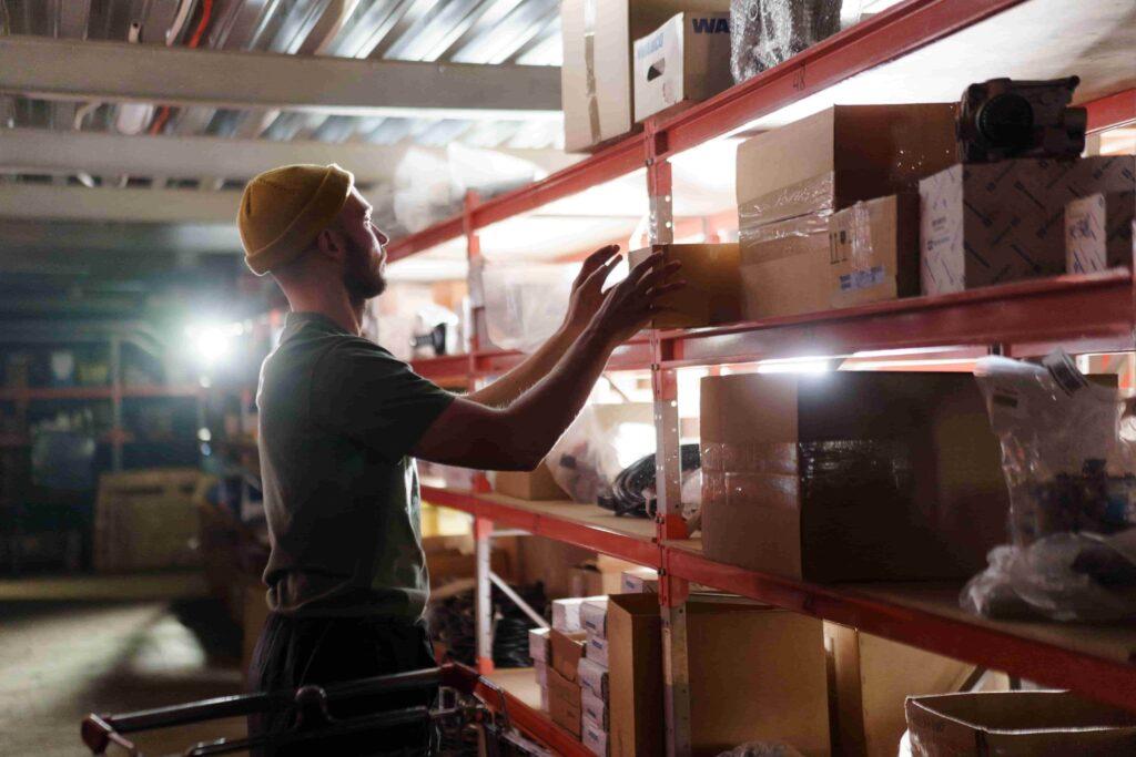 person sorting stuffs on shelves using vachi Personal Storage Unit in dubai