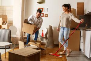 Young Couple Cleaning And Selecting Things